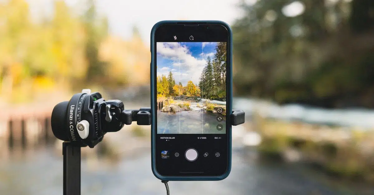Person using a smartphone camera to take professional-quality photos with natural lighting